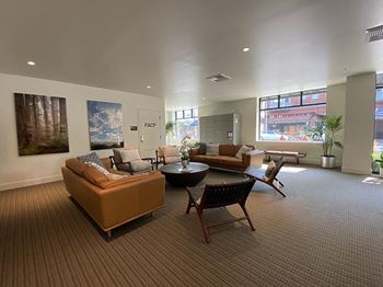 Large room with seating and package lockers at Second & B Street, San Rafael, CA, 94901